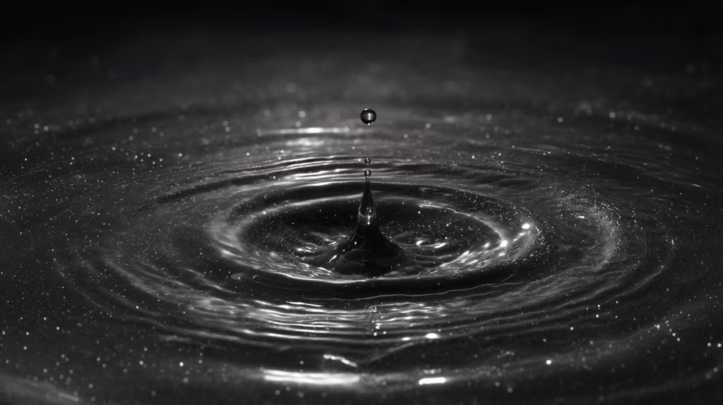 god view minimalist shot of obsidian-black circular water puddle, raindrops falling at golden ratio intervals (0.618s), ripple edges mutating into Mandelbrot fractal coastlines upon boundary contact, final droplet suspended 1μm above surface with quantum tunneling corona effect, hyper-detailed fluid simulation in monochrome mercury-silver palette, anamorphic bokeh streaks refracting inverted classroom constellations, shot on ARRI Alexa 65 with Laowa 24mm Probe lens at 1000fps