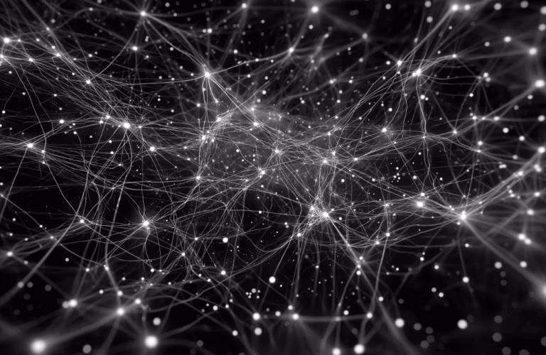 neurons and synapses light up white on a black background millions of connections